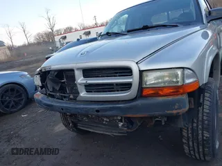 2002 Dodge Dakota Sport with VIN 1B7HG38N12S661043, listed as a IAAI auction lot 41552725 with 206,662 mi miles. Bid and sale history available at carsss.com. Image 6.