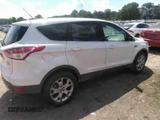 2013 Ford Escape SEL with VIN 1FMCU0HX1DUB63673, listed as a IAAI auction lot 42232003 with 116,230 mi miles and . Bid and sale history available at DreamBid. Image 4.