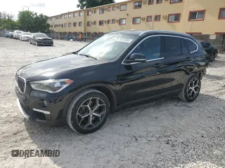 2019 BMW X1 xDrive28i with VIN WBXHT3C59K5L36435, listed as a Copart auction lot 60189985 with 105,110 mi miles and Salvage title. Bid and sale history available at DreamBid. Image 1.