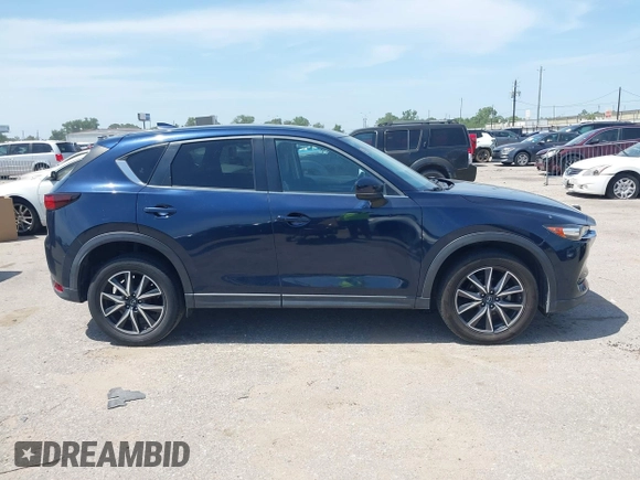 2018 Mazda CX-5 Touring z VIN JM3KFACM7J1410275, wystawiony jako IAAI lot #42248830 z przebiegiem 101 125 mil mil oraz . Historia ofert i sprzedaży dostępna na DreamBid. Obrazek 13.