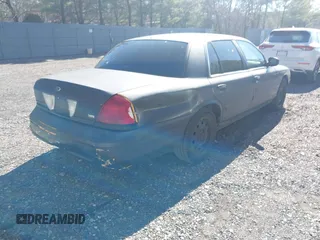 2011 Ford Crown Victoria with VIN 2FABP7AV9BX121739, listed as a IAAI auction lot 41763311 with 215,727 mi miles. Bid and sale history available at carsss.com. Image 4.