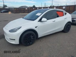 2021 Tesla Model Y Long Range with VIN 5YJYGDEE2MF074246, listed as a IAAI auction lot 40456971 with 94,527 mi miles. Bid and sale history available at carsss.com. Image 2.