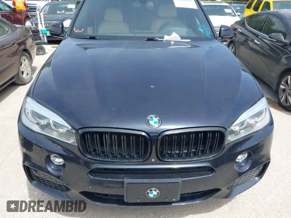 2014 BMW X5 xDrive50i with VIN 5UXKR6C55E0C03743, listed as a IAAI auction lot 42268302 with 118,892 mi miles and . Bid and sale history available at DreamBid. Image 6.