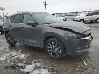 2017 Mazda CX-5 Grand Select with VIN JM3KFADL9H0205417, listed as a Copart auction lot 85123264 with 132,383 mi miles and Salvage Title. Bid and sale history available at carsss.com. Image 4.