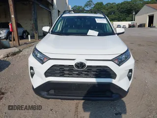 2019 Toyota RAV4 XLE with VIN JTMP1RFV0KD020442, listed as a IAAI auction lot 40108049 with 70,916 mi miles and . Bid and sale history available at DreamBid. Image 6.
