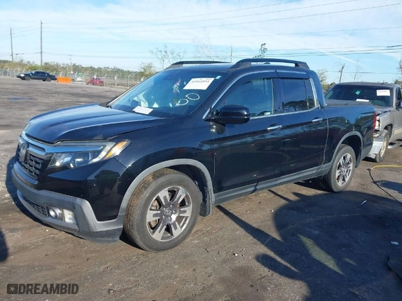 2018 Honda Ridgeline RTL-E with VIN 5FPYK3F78JB013981, listed as a IAAI auction lot 41844954 with 101,794 mi miles. Bid and sale history available at carsss.com. Image 2.