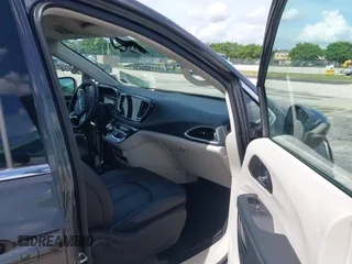 2023 Chrysler Pacifica Hybrid Touring L with VIN 2C4RC1L74PR579782, listed as a IAAI auction lot 42487390 with Not provided miles and . Bid and sale history available at DreamBid. Image 5.