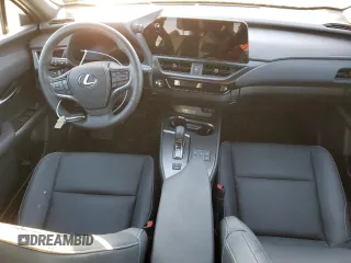 2025 Lexus UX with VIN JTHUCJDH8S2000784, listed as a Copart auction lot 86958384 with 0 mi miles and Salvage Title. Bid and sale history available at carsss.com. Image 8.