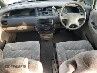 1998 Honda Odyssey with VIN RA31038664, listed as a Copart auction lot 43051785 with 106,084 mi miles and Salvage title. Bid and sale history available at DreamBid. Image 8.