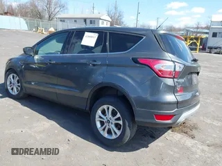 2017 Ford Escape SE with VIN 1FMCU9GD5HUC17297, listed as a IAAI auction lot 41880013 with 57,737 mi miles and . Bid and sale history available at DreamBid. Image 3.