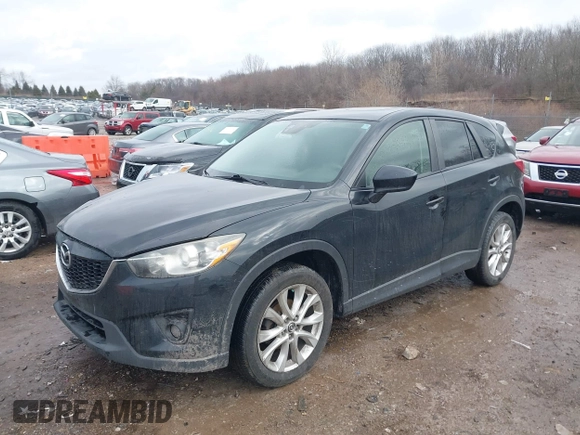2014 Mazda CX-5 Grand Touring with VIN JM3KE4DY5E0373731, listed as a IAAI auction lot 41517852 with 148,414 mi miles. Bid and sale history available at carsss.com. Image 2.
