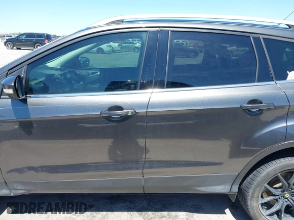 2017 Ford Escape Titanium with VIN 1FMCU0J97HUE07747, listed as a IAAI auction lot 41977788 with 104,560 mi miles. Bid and sale history available at carsss.com. Image 14.