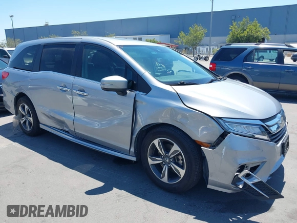 2018 Honda Odyssey Touring with VIN 5FNRL6H81JB022975, listed as a IAAI auction lot 42653304 with 210,137 mi miles and . Bid and sale history available at DreamBid. Image 1.