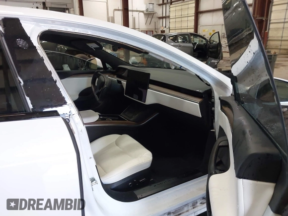 2022 Tesla Model S with VIN 5YJSA1E59NF469984, listed as a IAAI auction lot 42426490 with Not provided miles and . Bid and sale history available at DreamBid. Image 5.