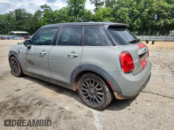 2015 MINI Hardtop 4 Door with VIN WMWXS5C5XFT831555, listed as a Copart auction lot 61673485 with 104,120 mi miles and Salvage title. Bid and sale history available at DreamBid. Image 2.
