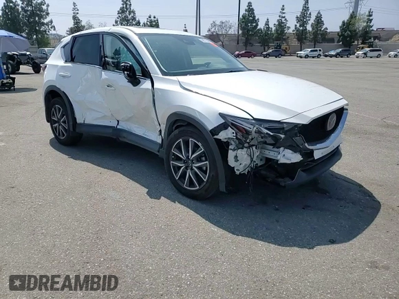 2018 Mazda CX-5 Grand Touring z VIN JM3KFADM3J1464073, wystawiony jako Copart lot #59571385 z przebiegiem Nie podano mil oraz Szkoda całkowita • Salvage title. Historia ofert i sprzedaży dostępna na DreamBid. Obrazek 14.