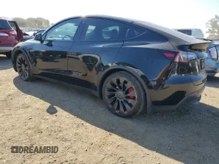 2022 Tesla Model Y Performance with VIN 7SAYGDEF1NF486218, listed as a Copart auction lot 63127435 with 99,302 mi miles and Salvage title. Bid and sale history available at DreamBid. Image 2.