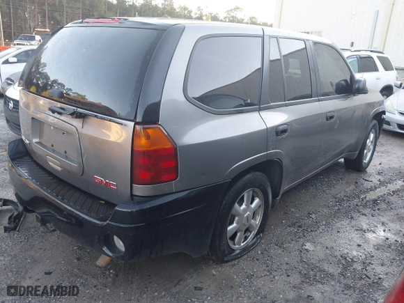 2005 GMC Envoy SLE with VIN 1GKDS13S352215032, listed as a IAAI auction lot 41221612 with 260,647 mi miles. Bid and sale history available at carsss.com. Image 4.