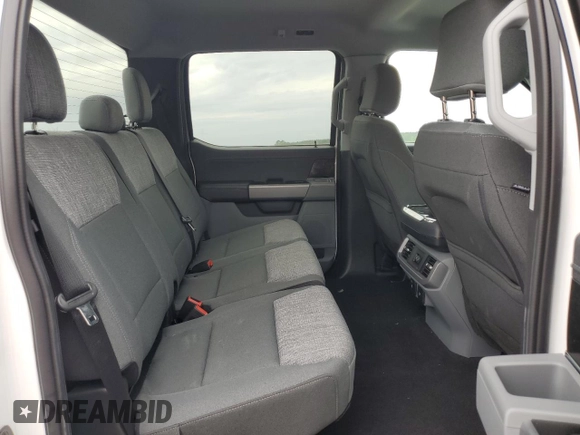 2023 Ford F-150 Lightning Pro z VIN 1FTVW1ELXPWG63466, wystawiony jako Copart lot #59163895 z przebiegiem Nie podano mil oraz Szkody całkowita. Historia ofert i sprzedaży dostępna na DreamBid. Obrazek 10.