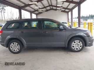 2015 Dodge Journey SE z VIN 3C4PDCAB1FT617794, wystawiony jako IAAI lot #41922371 z przebiegiem 130 558 mil mil oraz . Historia ofert i sprzedaży dostępna na DreamBid. Obrazek 14.