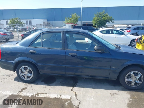 1999 Mazda Protege DX z VIN JM1BJ2229X0189290, wystawiony jako IAAI lot #41796448 z przebiegiem 281 528 mil mil oraz . Historia ofert i sprzedaży dostępna na DreamBid. Obrazek 14.