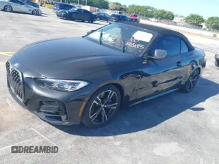 2023 BMW 4 Series M440i with VIN WBA53AT08PCL58435, listed as a IAAI auction lot 41745514 with 23,161 mi miles and . Bid and sale history available at carsss.com. Image 2.