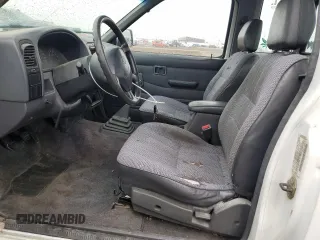 1997 Nissan Frontier XE with VIN 1N6SD16S8VC426940, listed as a Copart auction lot 55860235 with 242,265 mi miles and Salvage title. Bid and sale history available at DreamBid. Image 7.