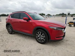2018 Mazda CX-5 Grand Touring with VIN JM3KFADM8J0451535, listed as a Copart auction lot 59990435 with 77,163 mi miles and Salvage title. Bid and sale history available at DreamBid. Image 4.