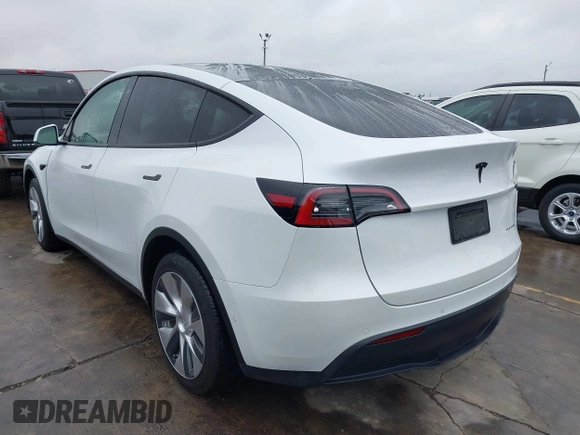 2022 Tesla Model Y Long Range with VIN 7SAYGDEE3NF380067, listed as a IAAI auction lot 41016704 with 52,180 mi miles and . Bid and sale history available at DreamBid. Image 3.