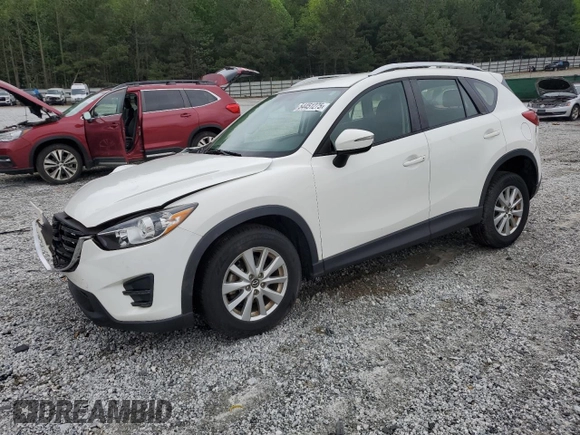 2016 Mazda CX-5 Sport with VIN JM3KE2BY0G0843786, listed as a Copart auction lot 54451275 with 111,363 mi miles and Salvage title. Bid and sale history available at DreamBid. Image 1.