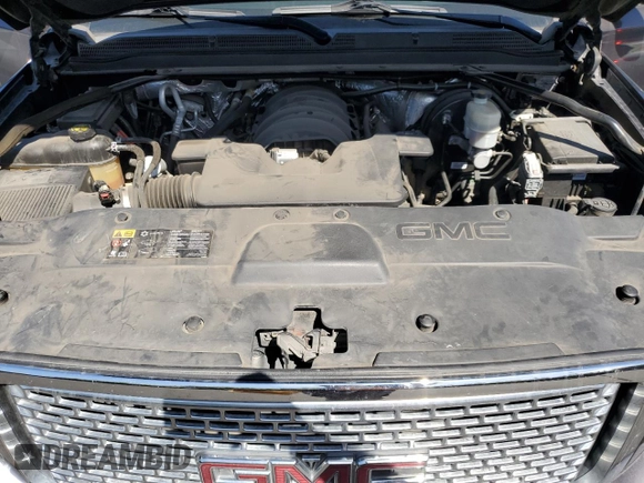 2015 GMC Yukon Denali with VIN 1GKS2CKJ8FR596848, listed as a Copart auction lot 52048105 with 129,935 mi miles and Salvage Title. Bid and sale history available at carsss.com. Image 12.