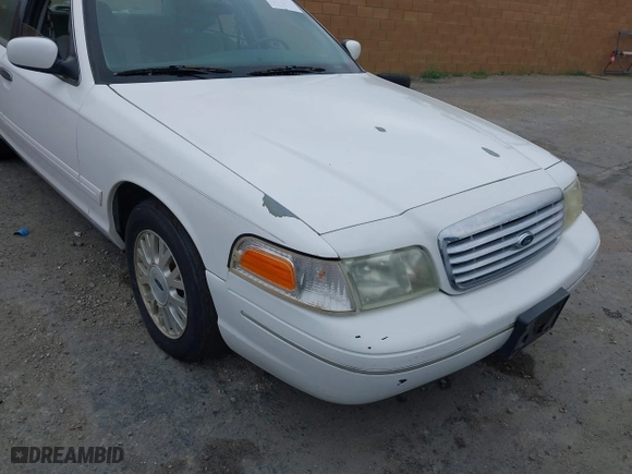 2003 Ford Crown Victoria LX with VIN 2FAFP74WX3X154904, listed as a IAAI auction lot 42094274 with 123,579 mi miles. Bid and sale history available at carsss.com. Image 6.