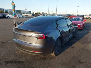2021 Tesla Model 3 Long Range with VIN 5YJ3E1EBXMF995814, listed as a IAAI auction lot 41838453 with 51,415 mi miles. Bid and sale history available at carsss.com. Image 4.