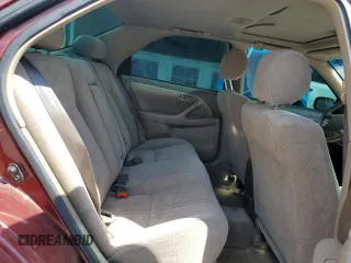 2000 Toyota Camry CE z VIN JT2BG22K4Y0449443, wystawiony jako Copart lot #58268475 z przebiegiem 292 853 mil mil oraz Szkoda całkowita • Salvage title. Historia ofert i sprzedaży dostępna na DreamBid. Obrazek 10.