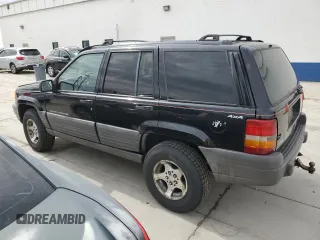 1996 Jeep Grand Cherokee with VIN 1J4EZ58S8TC106529, listed as a Copart auction lot 50163965 with 226,951 mi miles and Salvage title. Bid and sale history available at DreamBid. Image 2.
