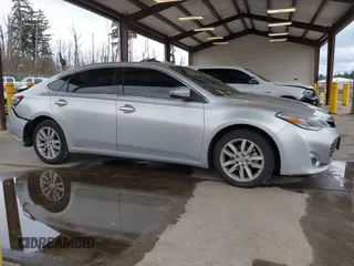 2014 Toyota Avalon Limited with VIN 4T1BK1EB3EU104576, listed as a IAAI auction lot 41773431 with 105,419 mi miles. Bid and sale history available at carsss.com. Image 13.