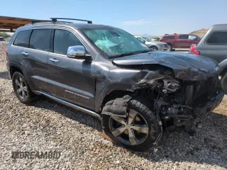 2014 Jeep Grand Cherokee Summit with VIN 1C4RJFJM8EC395169, listed as a Copart auction lot 60637265 with 116,575 mi miles and Salvage title. Bid and sale history available at DreamBid. Image 4.