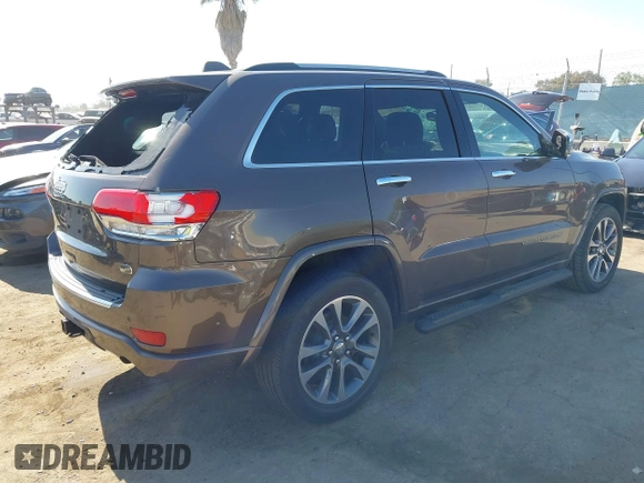 2017 Jeep Grand Cherokee Overland z VIN 1C4RJECG0HC960178, wystawiony jako IAAI lot #42315844 z przebiegiem 63 271 mil mil oraz . Historia ofert i sprzedaży dostępna na DreamBid. Obrazek 4.