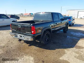 2005 Chevrolet Silverado 1500 LS with VIN 2GCEK13T551184097, listed as a IAAI auction lot 41598653 with 218,461 mi miles. Bid and sale history available at carsss.com. Image 4.