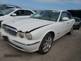2004 Jaguar XJ with VIN SAJWA71C44SG34094, listed as a Copart auction lot 74969004 with 0 mi miles and Salvage Title. Bid and sale history available at carsss.com. Image 1.