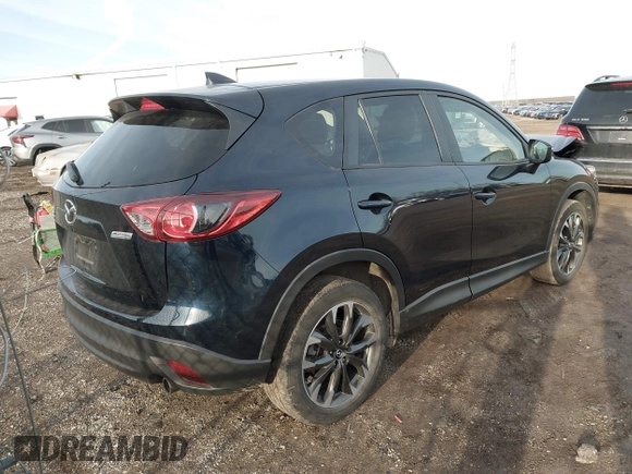 2016 Mazda CX-5 Grand Touring with VIN JM3KE4DY1G0823989, listed as a IAAI auction lot 41770149 with 40,677 mi miles. Bid and sale history available at carsss.com. Image 4.