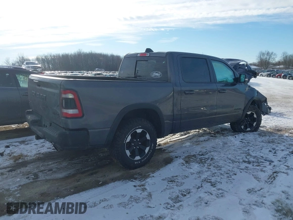2022 Ram 1500 Rebel z VIN 1C6SRFLT9NN204868, wystawiony jako IAAI lot #41351273 z przebiegiem 67 120 mil mil oraz . Historia ofert i sprzedaży dostępna na DreamBid. Obrazek 4.