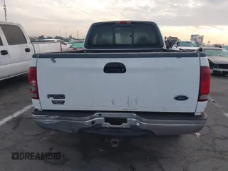 1999 Ford F-150 XL with VIN 1FTRX18L1XKB61205, listed as a IAAI auction lot 40991236 with 178,889 mi miles. Bid and sale history available at carsss.com. Image 16.
