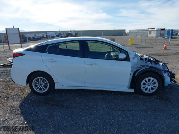 2021 Toyota Prius L Eco with VIN JTDKAMFU9M3150667, listed as a IAAI auction lot 41609328 with 59,177 mi miles. Bid and sale history available at carsss.com. Image 14.