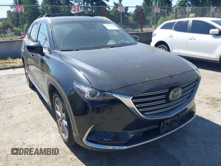 2018 Mazda CX-9 Grand Touring z VIN JM3TCBDY2J0237050, wystawiony jako IAAI lot #42457060 z przebiegiem 130 625 mil mil oraz . Historia ofert i sprzedaży dostępna na DreamBid. Obrazek 6.