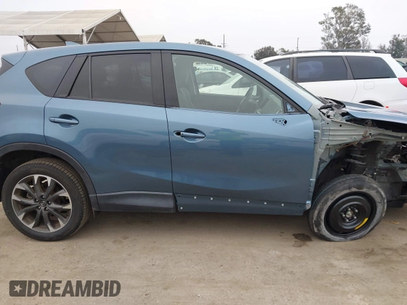 2016 Mazda CX-5 Grand Touring with VIN JM3KE2DY7G0875678, listed as a IAAI auction lot 42104888 with 30,566 mi miles. Bid and sale history available at carsss.com. Image 14.