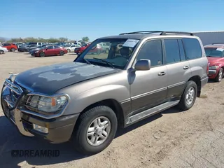 2000 Lexus LX 470 with VIN JT6HT00WXY0079873, listed as a IAAI auction lot 41605770 with 302,758 mi miles and . Bid and sale history available at DreamBid. Image 2.