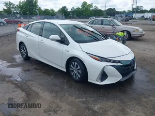 2020 Toyota Prius LE z VIN JTDKARFP5L3121530, wystawiony jako IAAI lot #42279945 z przebiegiem 128 235 mil mil oraz . Historia ofert i sprzedaży dostępna na DreamBid. Obrazek 1.