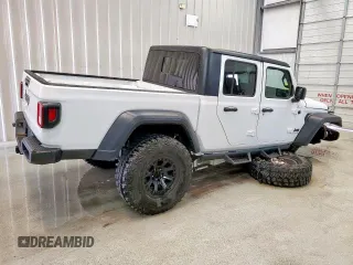 2023 Jeep Gladiator Sport S with VIN 1C6HJTAG1PL542530, listed as a Copart auction lot 60669075 with 44,323 mi miles and Salvage title. Bid and sale history available at DreamBid. Image 4.