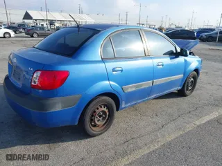 2009 Kia Rio with VIN KNADE223296502151, listed as a IAAI auction lot 41602918 with 143,996 mi miles. Bid and sale history available at carsss.com. Image 4.